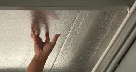 PE insulation sheet for installation under metal sheet roof ceiling. Stock Footage 274147250