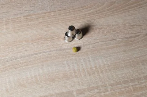 Pea and three thimble Stock Photos