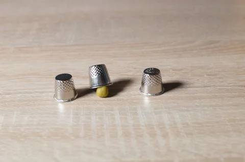 Pea and three thimble Stock Photos