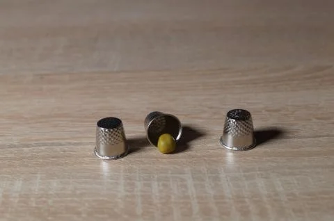 Pea and three thimble Stock Photos