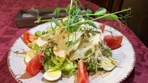 Pea microgreens Caesar salad. Classic Caesar salad with romaine lettuce Video stock 281729046
