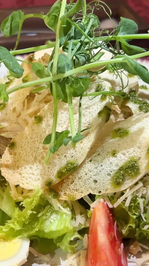Pea microgreens Caesar salad. Classic Caesar salad with romaine lettuce Video stock 281732417