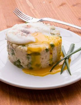 Pea risotto with egg fresh vegetarian pea risotto with poached egg Copyrig... Stock Photos