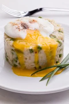 Pea risotto with egg Stock Photos