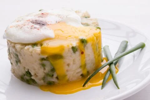 Pea risotto with egg Stock Photos