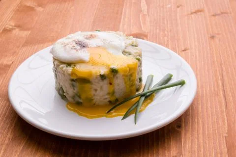 Pea risotto with egg Stock Photos