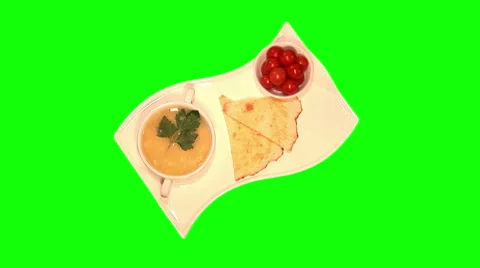 Pea soup, cherry tomatoes, flat cake on tray Stock Footage 46460916