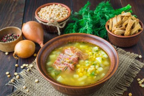 Pea soup. Traditional soup with peas, vegetables and smoked ribs Stock Photos