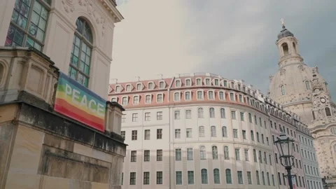 Peace and pride rainbow flag in historic downtown Dresden with Frauenkirche Stock Footage 203961332