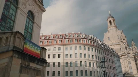 Peace and pride rainbow flag in historic downtown Dresden with Frauenkirche Stock Footage 203961344