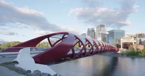 Peace Bridge Calgary Alberta pan to downtown Bow River Stock Footage 137766488