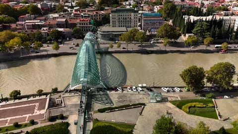 Peace Bridge over the Mtkvari River in Tbilisi, Georgia Stock Footage 305780023