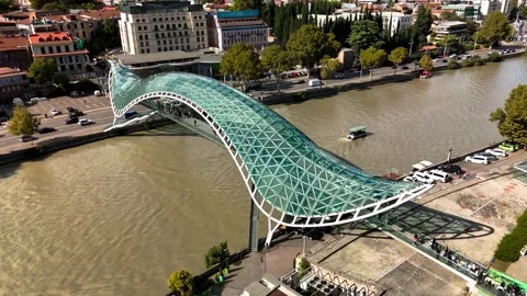 Peace Bridge over the Mtkvari River in Tbilisi, Georgia Stock Footage 305780145