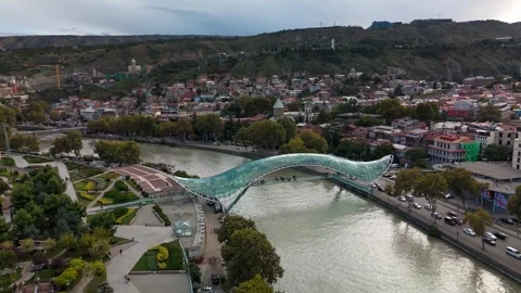 Peace Bridge over the Mtkvari River in Tbilisi, Georgia Stock Footage 305781051
