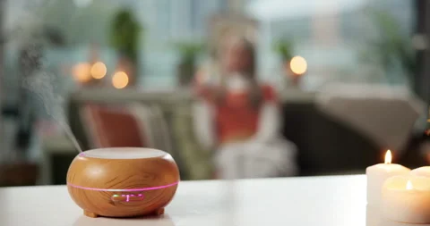 Peace, candle and relax with diffuser in home for aromatherapy, calm and stress Video stock 312743383