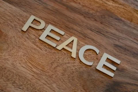 Peace message on wooden surface Stock Photos