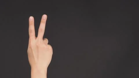 Peace sign.It is hand gesturing two finger on white background Foto stock