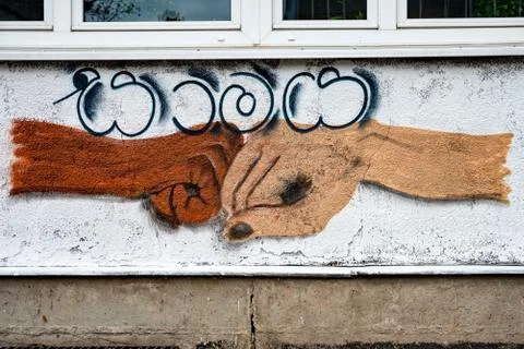 Peace sprayed on a wall in Sinhalese Stock Photos