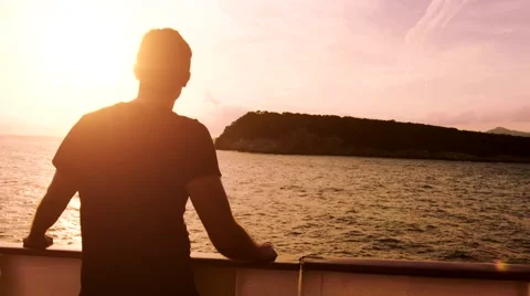Peace Tranquility Young Man Standing Deck Ship Sunset Ocean Island Cruise Stock Footage