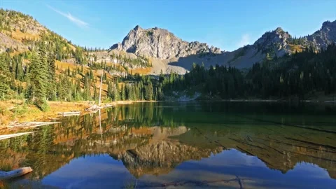 Peaceful alpine lake reflection on the Sheep Lake Trail near Mount Rainier Natio Stock Footage 332141076