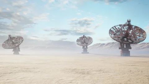 Peaceful arid terrain features rotating dishes under morning cloud cover Stock Footage 327860067