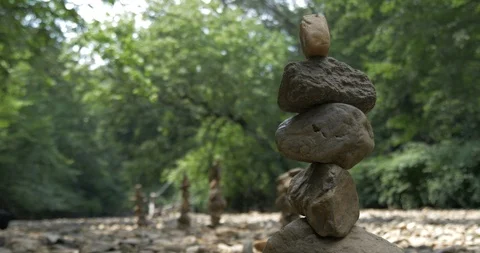 Peaceful Art Practice Balancing Rocks Stacking with Trees and Forrest 스톡 동영상 113284797