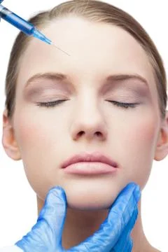 Peaceful attractive model having botox injection on the forehead Stock Photos