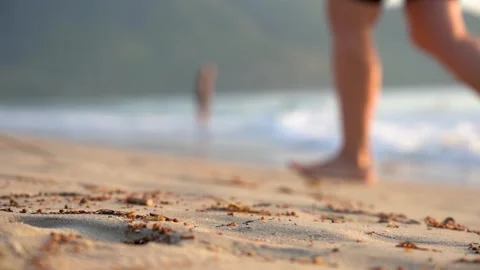 A Peaceful Beach Scene Captured in Two Frames, Highlighting Sand, Sea, and a Stock Footage 346742587