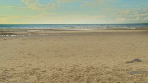 Peaceful beach scene, with waves lapping at the shore. High quality HD video Stock-Footage 32961594