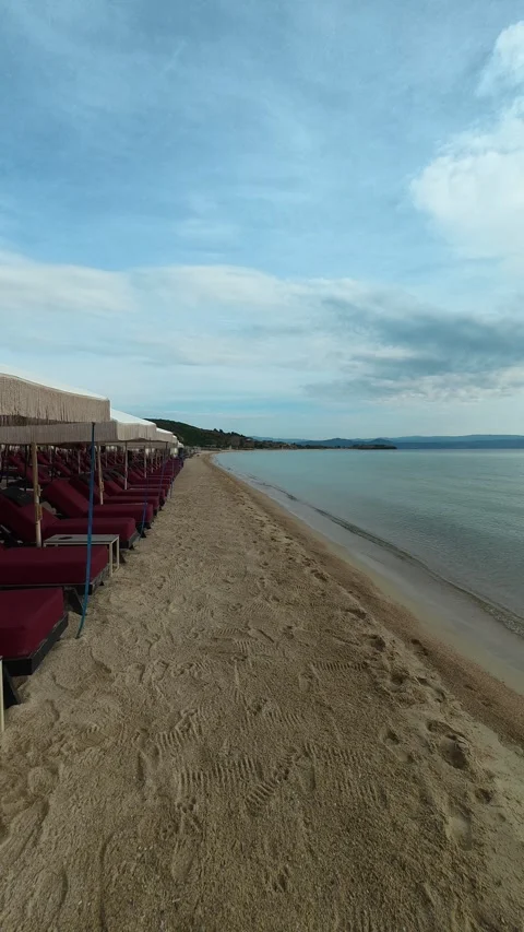 Peaceful beach under soft, cloudy sky. Trani Ammouda, Vertical Stock Footage 340649905