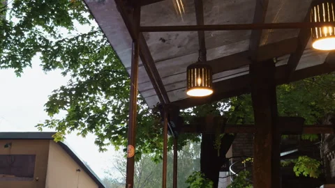 Peaceful cafe outdoor space featuring rustic elements and soft ambient 库存影片 319410185