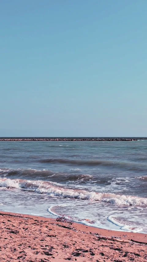 Peaceful Coastal Setting Featuring Soft Surf And Calm Atmosphere Stock Footage 331747812