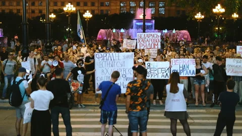 Peaceful crowd of activists standing with protest strike banners and placards. Stock Footage 160985998