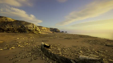 Peaceful dusk casting warm amber hues across rough cliffs and sandy beaches Stock Footage 340659587