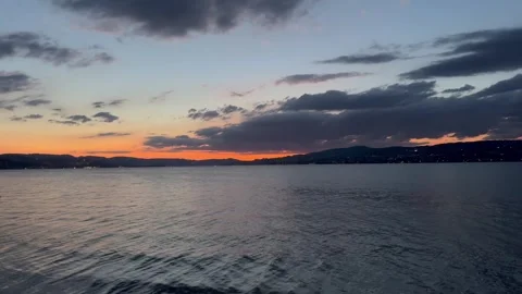 Peaceful Evening at Lake Zurich with Dramatic Clouds Stock Footage 341656305