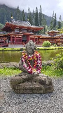 A peaceful horizontal eye level view of the traditional stone Buddha statue.. Stock Photos