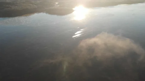 Peaceful Lake, Soft Cloud and Sun Reflection, Aerial Horizon Reveal 動画素材 146520359