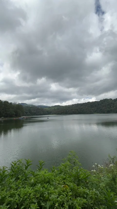 Peaceful Lake View with Dramatic Cloudy Sky at Situ Patenggang Indonesia Stock Footage 338174428