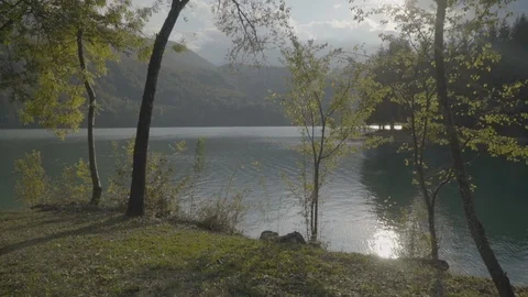 Peaceful landscape outdoors of lake and mountains in Italy - push in Stock Footage