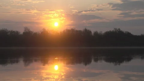 Peaceful landscape of quiet river, forest and rising sun Stock Footage