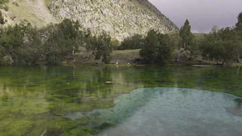 Peaceful mountain lake Satrangi in Gilgit Baltistan in Naltar Valley Video stock 287365652
