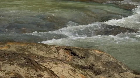 A peaceful mountain riverbank. Stock Footage 336877818