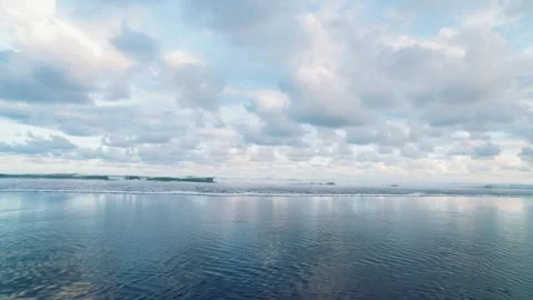 Peaceful Ocean Horizon Beneath Dramatic Cloudy Tropical Sky Stock Footage 337979175