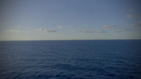 Peaceful ocean waves gently rolling onto the shoreline creating a relaxing Stock Footage 344956274
