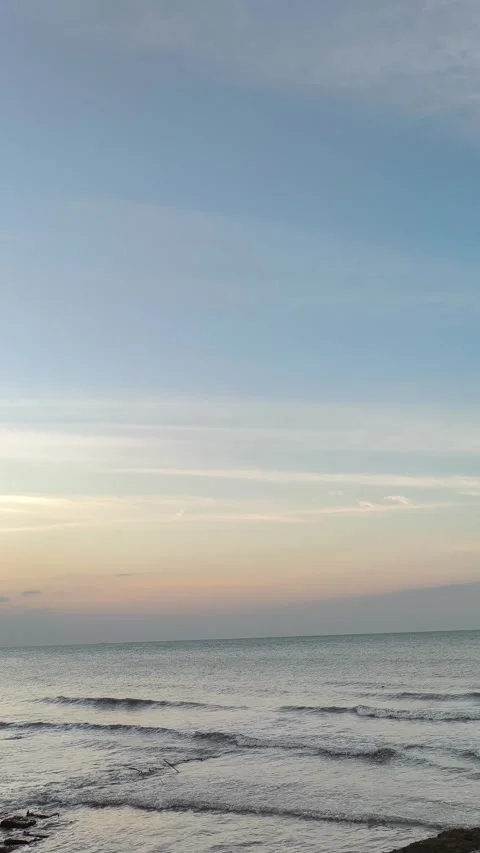 Peaceful Ocean Waves at Sunset Vertical Beach View Stock Footage 340489844