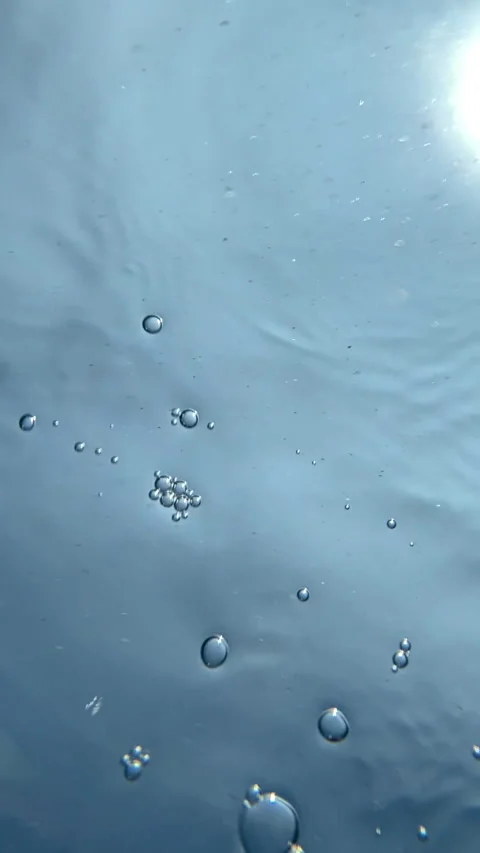 Peaceful open water with small waves shimmering under bright sunlight. A natural Stock Footage 337995644