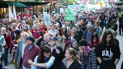 Peaceful protest in melbourne climate change lots of people walking green Video stock 145732328