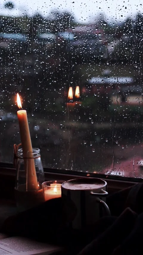 Peaceful Rainy Evening Window Scene with Candlelight Loop Stock Footage 337083519