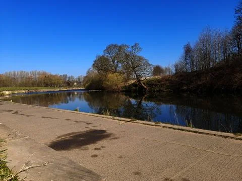 Peaceful River Path on a Bright Spring Day Stock Photos
