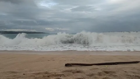 Peaceful Sandy Beach with Cloudy Sky and Gentle Waves. Stock Footage 318211281